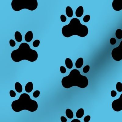 Pawprint Polka dots - 1 inch (2.54cm) - Black (#000000) on Pale Blue (#57BEE4)