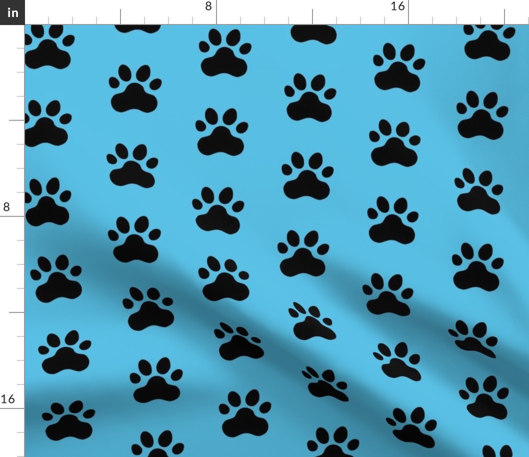 Pawprint Polka dots - 1 inch (2.54cm) - Black (#000000) on Pale Blue (#57BEE4)