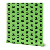 Pawprint Polka dots - 1 inch (2.54cm) - Black (#000000) on Light Green (#89DA65)