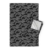 dinosaurs in black on charcoal grey