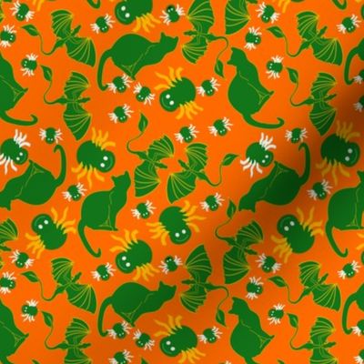 tossed green cats and spiders on orange
