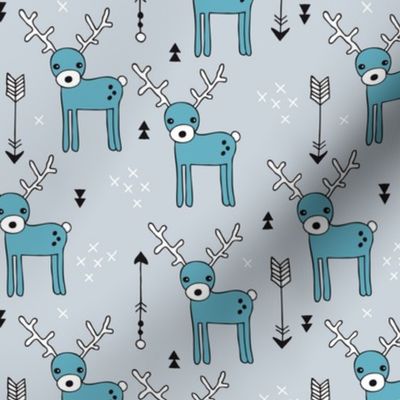 Adorable woodland reindeer and arrows christmas illustration kids pattern design in soft winter blue