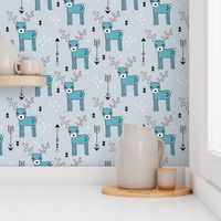 Adorable woodland reindeer and arrows christmas illustration kids pattern design in soft winter blue