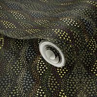 Snakeskin, golden dots on dark background