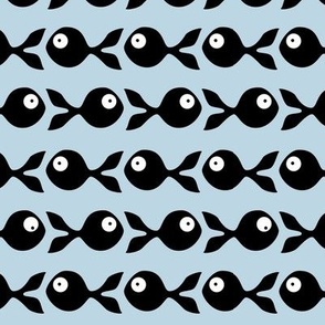 small - little fish swimming in black and blue