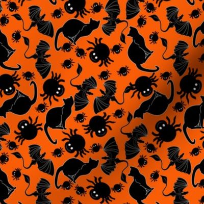 black cats and spiders on orange
