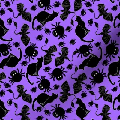 tossed black cats and spiders on purple