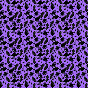 tossed black cats and spiders on purple