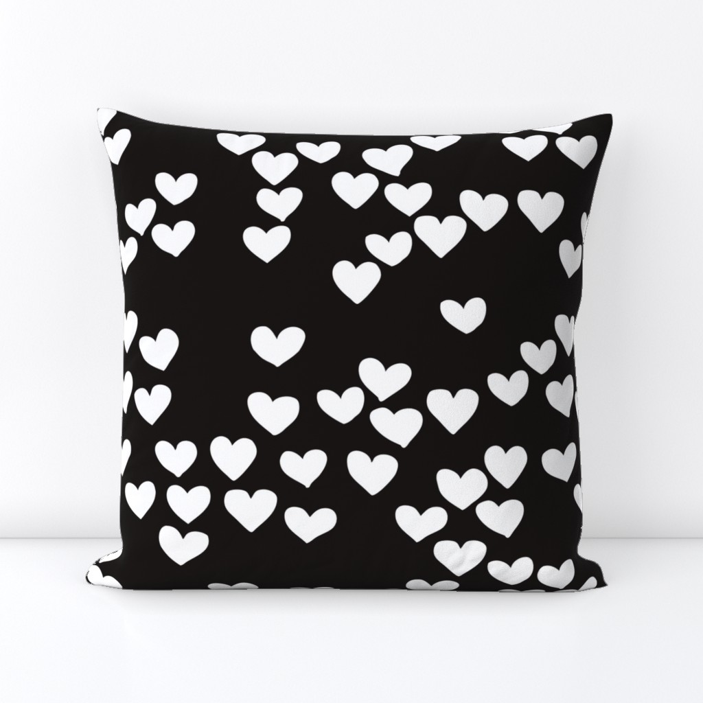 Pastel love hearts tossed hand drawn illustration pattern scandinavian style in neutral black and white