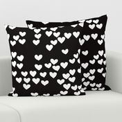 Pastel love hearts tossed hand drawn illustration pattern scandinavian style in neutral black and white