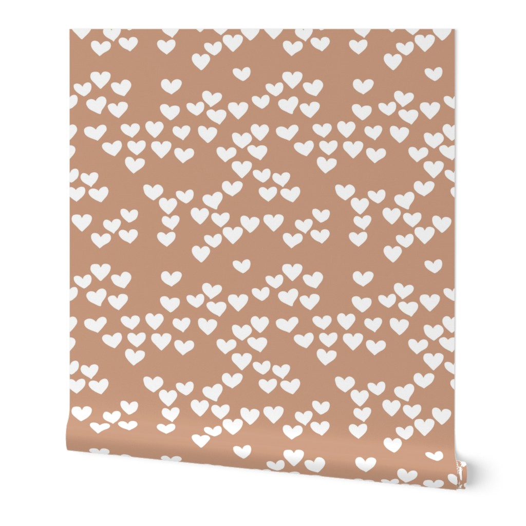 Pastel love hearts tossed hand drawn illustration pattern scandinavian style in soft ochre beige