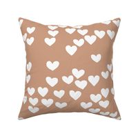 Pastel love hearts tossed hand drawn illustration pattern scandinavian style in soft ochre beige