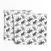 Trotting Miniature Schnauzers and paw prints - white