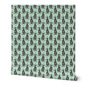 Small sitting Australian cattle dog - paw print green