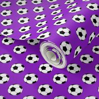 One Inch Black and White Soccer Balls on Purple