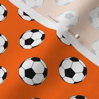 One Inch Black and White Soccer Balls on Orange