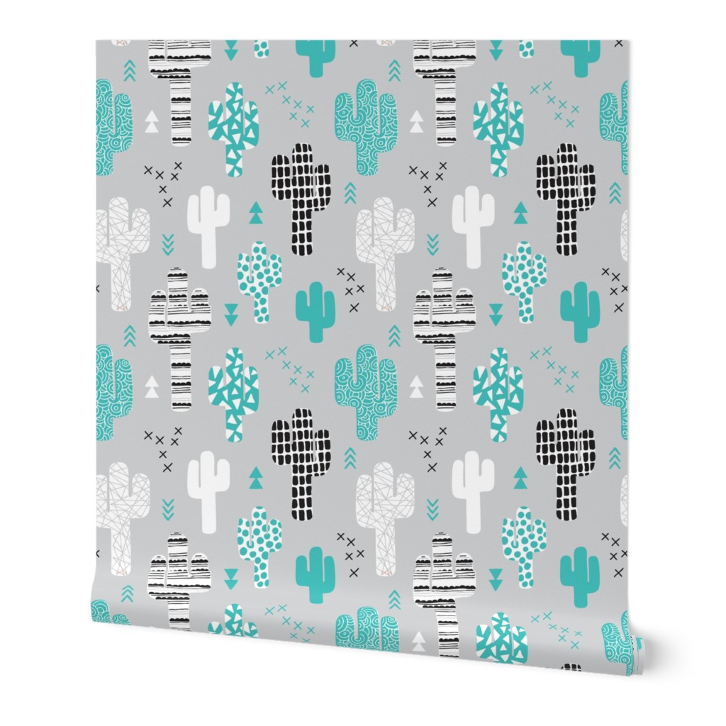 Cool western geometric cactus garden with triangles and arrows gender neutral pastel blue black and white