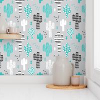 Cool western geometric cactus garden with triangles and arrows gender neutral pastel blue black and white