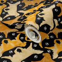 Trotting Golden Retrievers and paw prints - black