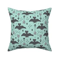 Cool bats flying dogs illustration design with geometric triangles and arrows for halloween and cool fashion in mint