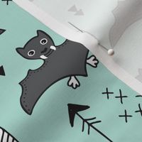 Cool bats flying dogs illustration design with geometric triangles and arrows for halloween and cool fashion in mint