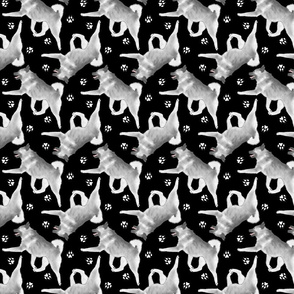 Trotting Norwegian Elkhound and paw prints - black