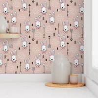 Cool hipster white bunny and geometric arrows spring easter design in gender neutral pastel beige