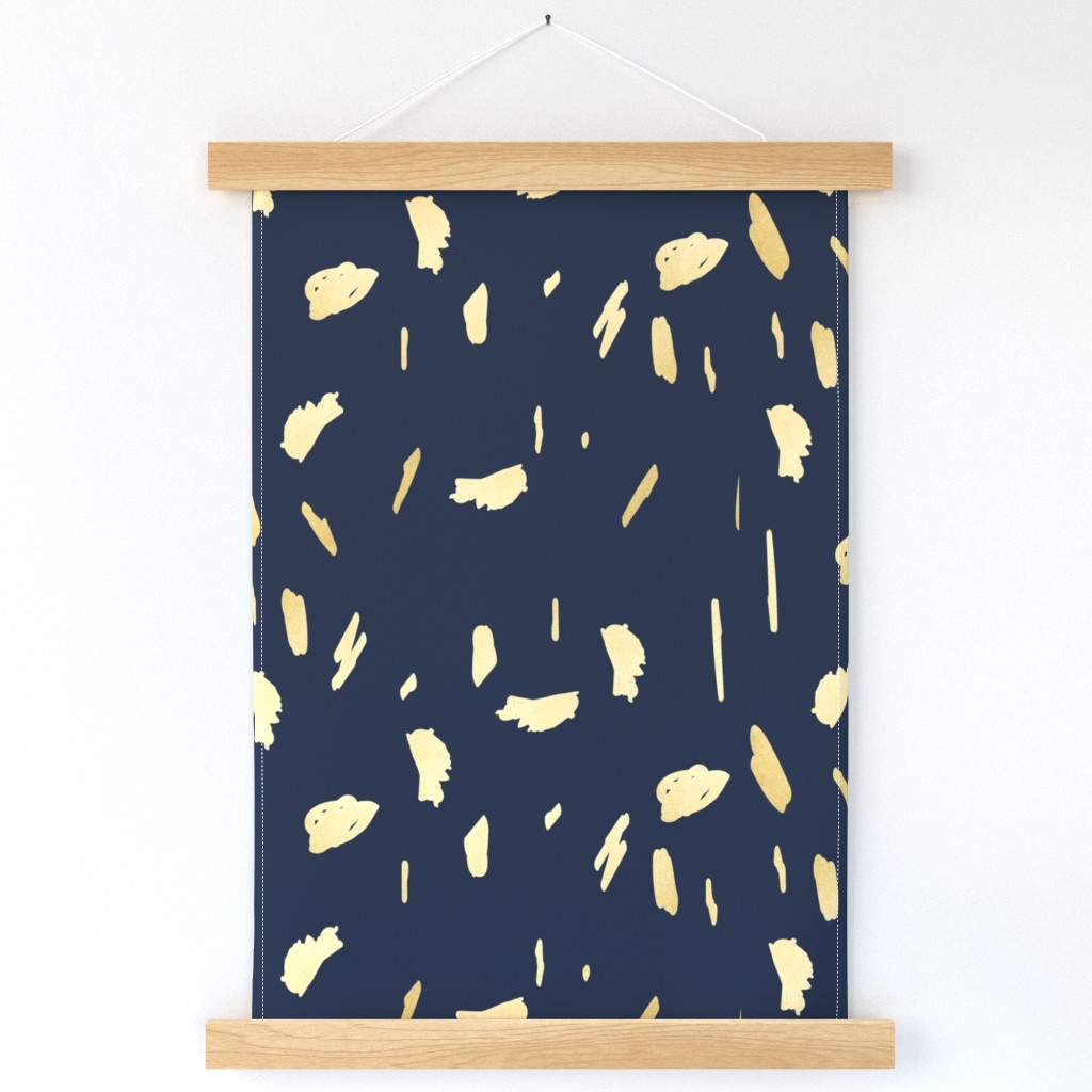 Gold paint blobs on navy blue