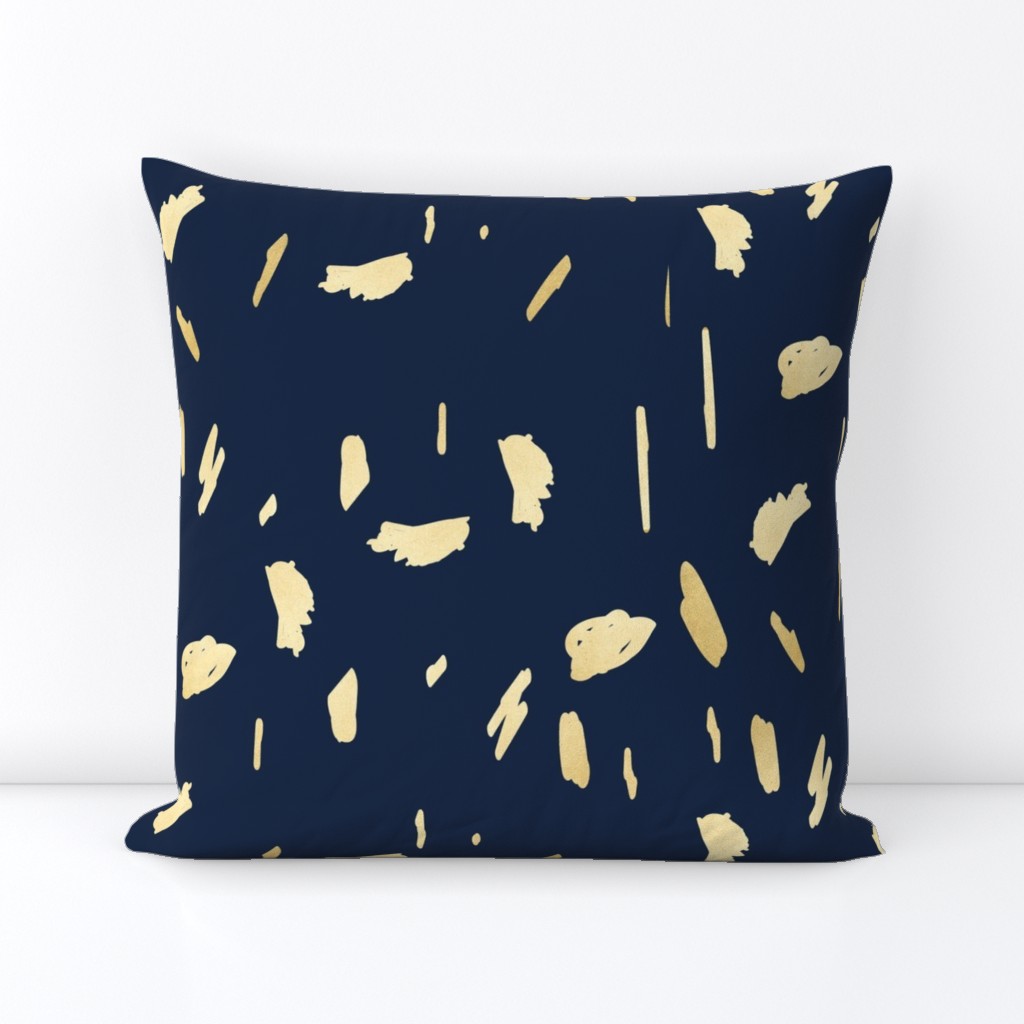 Gold paint blobs on navy blue