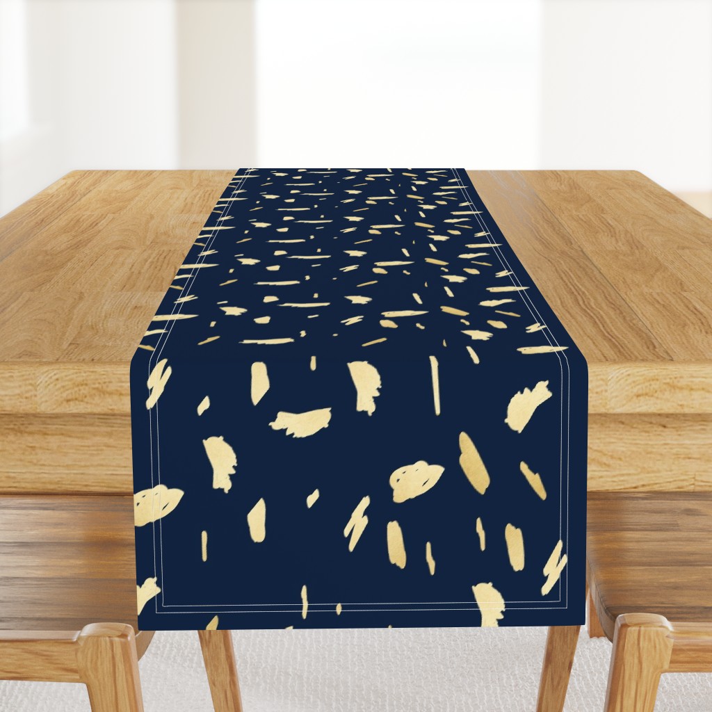 Gold paint blobs on navy blue