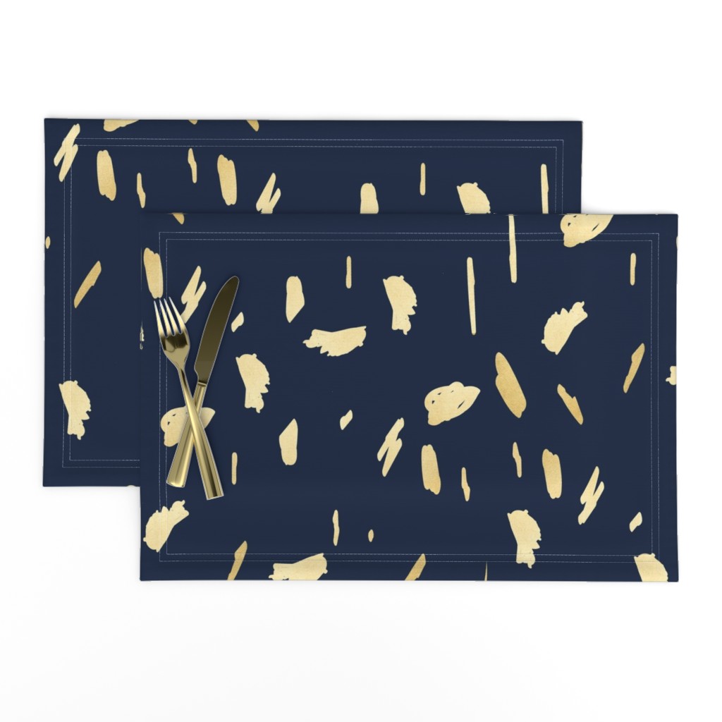 Gold paint blobs on navy blue