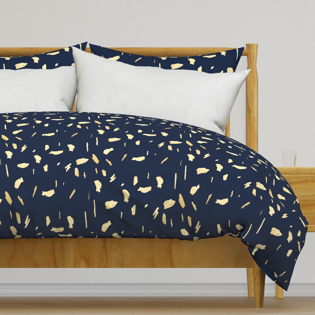 Gold paint blobs on navy blue