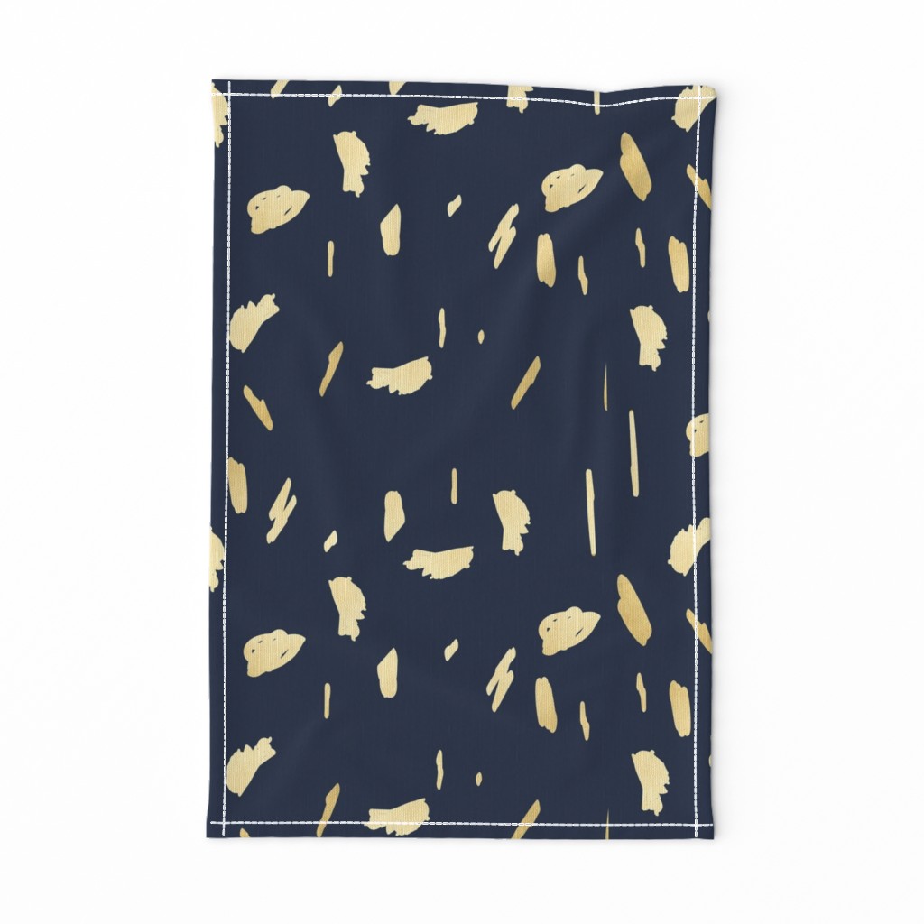 Gold paint blobs on navy blue