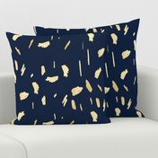 Gold paint blobs on navy blue