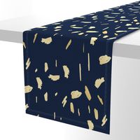 Gold paint blobs on navy blue