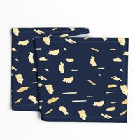 Gold paint blobs on navy blue