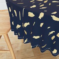 Gold paint blobs on navy blue