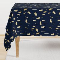 Gold paint blobs on navy blue