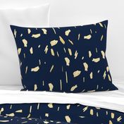 Gold paint blobs on navy blue