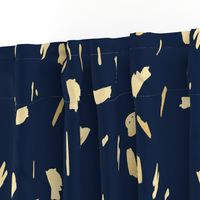 Gold paint blobs on navy blue