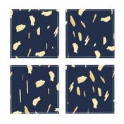 Gold paint blobs on navy blue