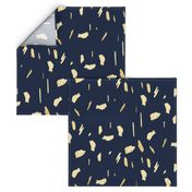 Gold paint blobs on navy blue