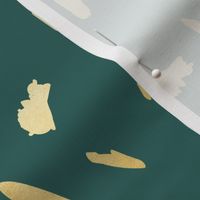 Gold paint blobs daubs on deep rich green