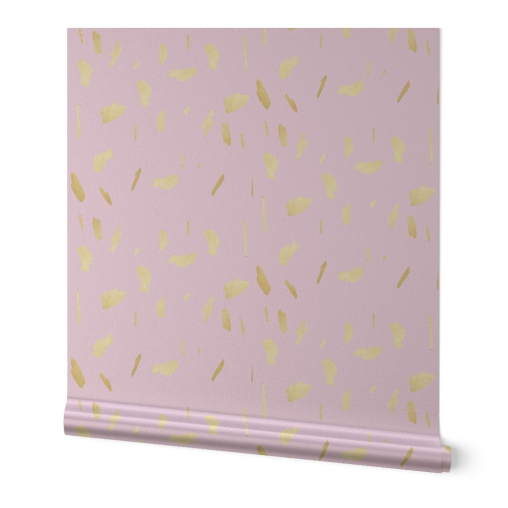 Gold paint blobs daubs on light pale pink