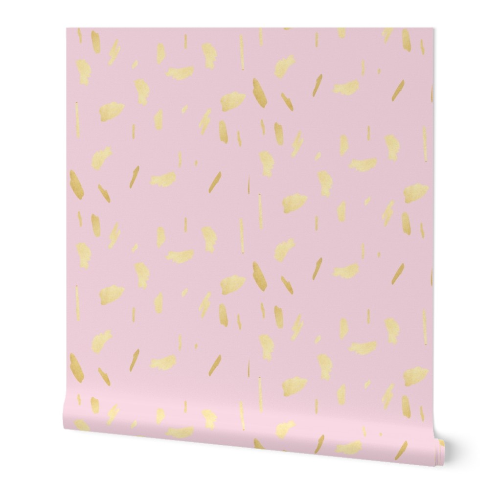 Gold paint blobs daubs on light pale pink