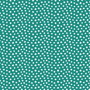 White spots on teal green