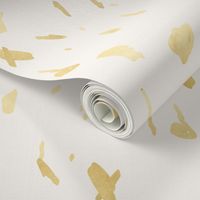 Gold paint blobs on cream