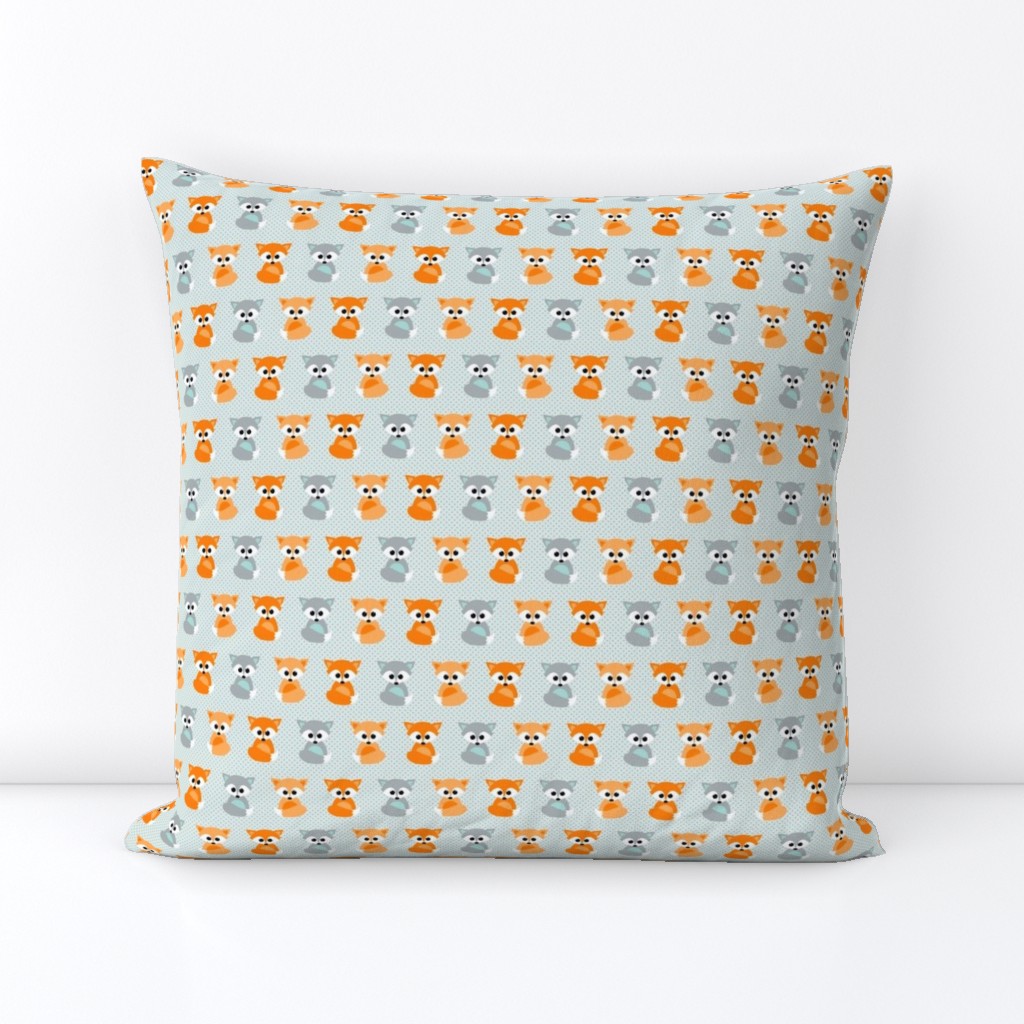 Baby foxes in orange and teal