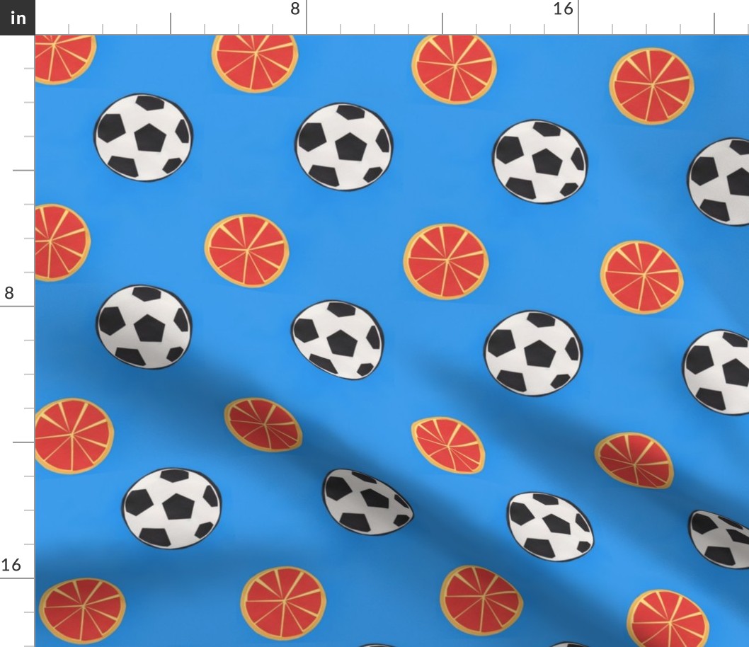 soccer balls and oranges - azure blue background
