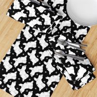 Trotting Maltese and paw prints - black